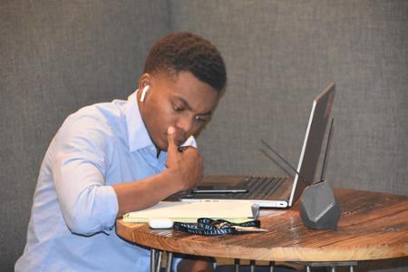 Student studying with a laptop.